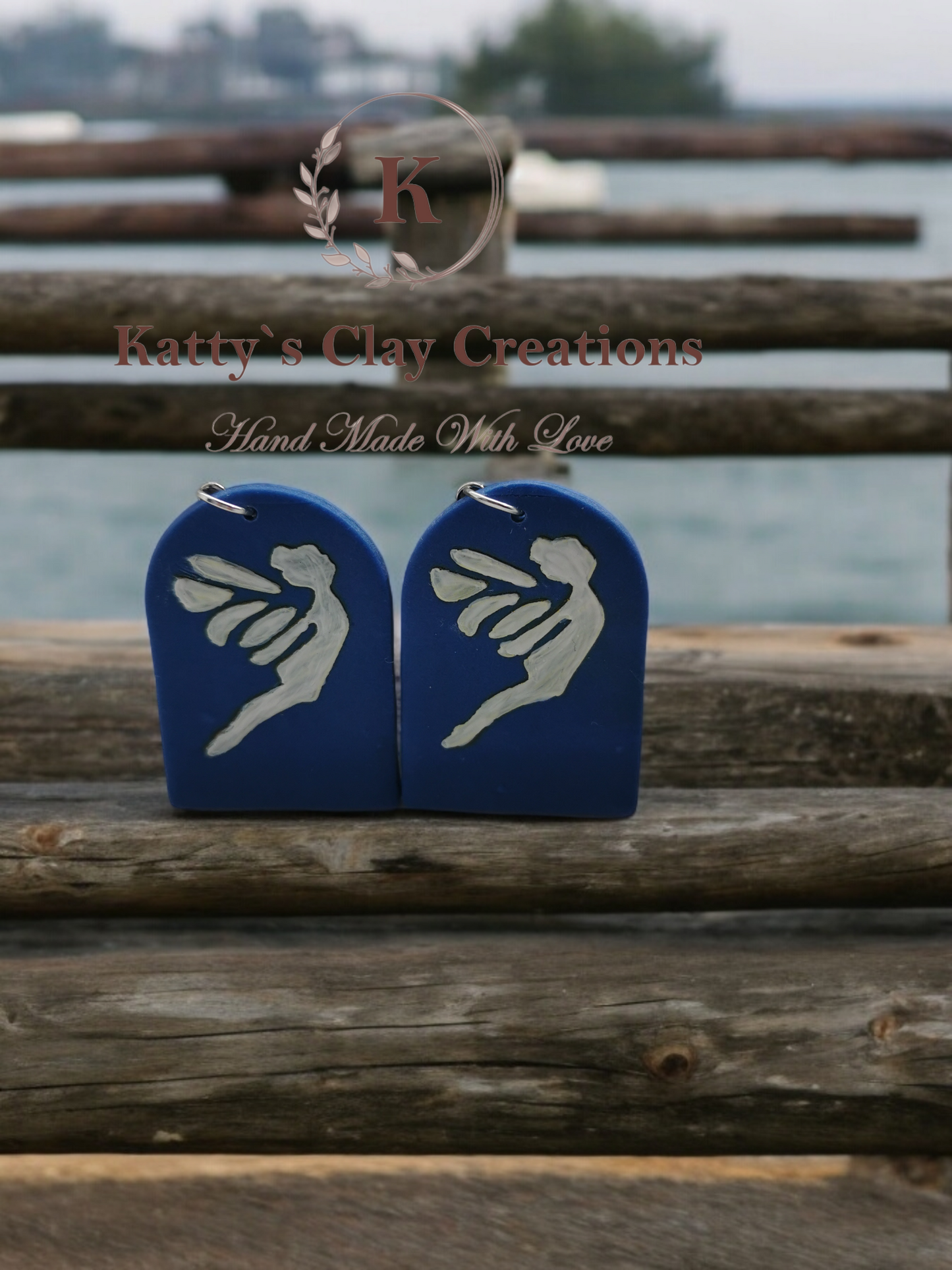 Polymer clay blue arc with printed white fairy