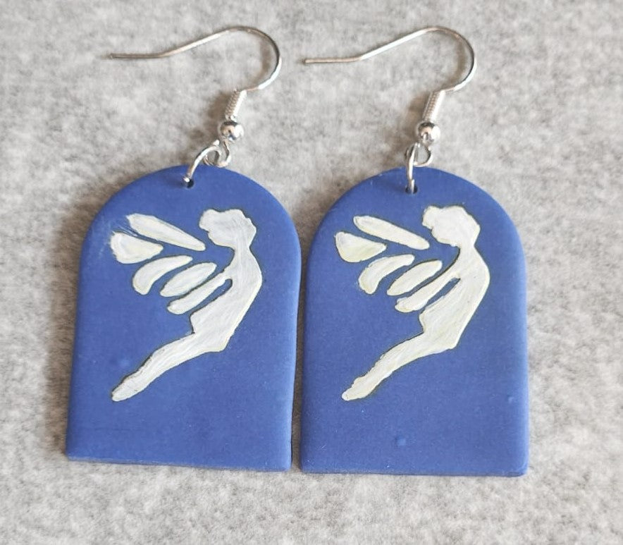 Polymer clay blue arc with printed white fairy